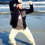 Audit Program Management Primer instructor Matthew on the Coast of Maine after the 2020 Kicks USA open Martial Arts tournament. Gold medals in his division for Kata, Kumite, and bronze in Weapons. 